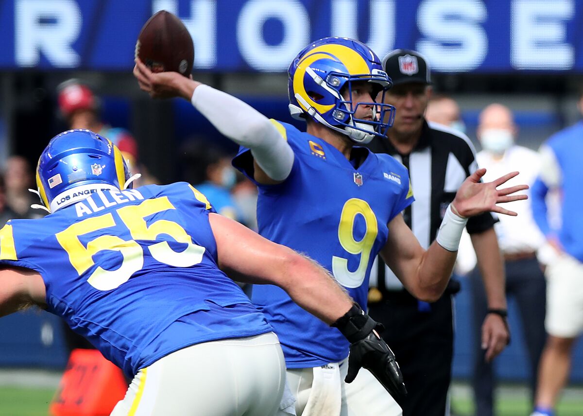 Rams quarterback Matthew Stafford throws a pass against the Lions.