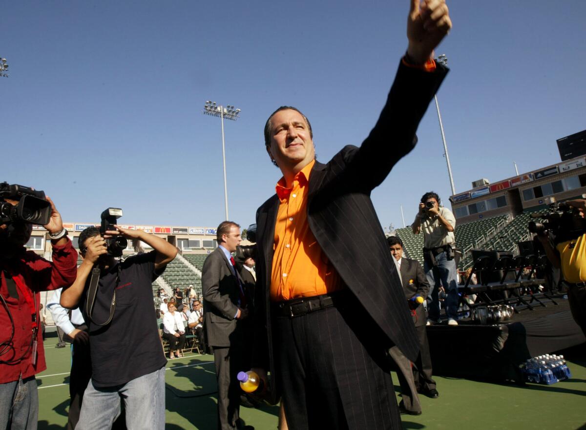 In this Aug. 2, 2004, file photo, Jorge Vergara waves to fans at a news conference in Carson.
