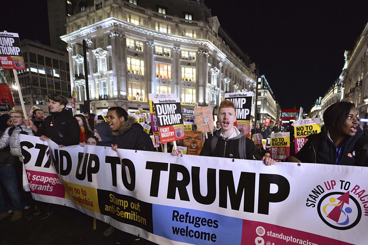 Marchers in central London demonstrate Friday against President Trump.