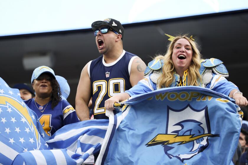 Los Angeles, CA - December 18: Los Angeles Chargers fans cheer during the first half against the Tennessee Titans at SoFi Stadium on Sunday, Dec. 18, 2022 in Los Angeles, CA.(Allen J. Schaben / Los Angeles Times)