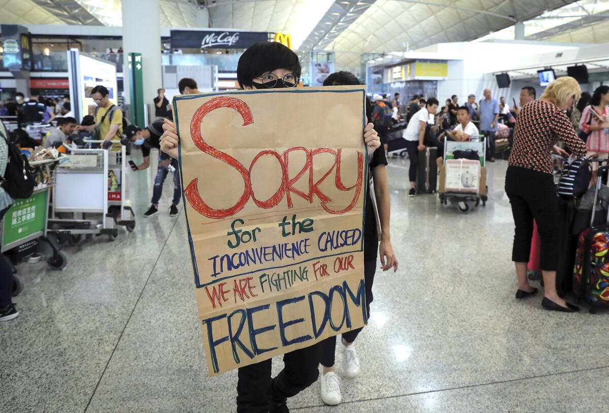 Protesters blocked passengers at departure halls of Hong Kong airport