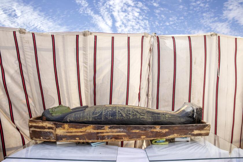 CORRECTS DAY OF WEEK TO SUNDAY -- A trove of ancient coffins and artifacts on display that Egyptian archaeologist Zahi Hawass and his team unearthed in a vast necropolis, in Saqqara, south of Cairo, Egypt, Sunday, Jan. 17, 2021. (AP Photo/Nariman El-Mofty)