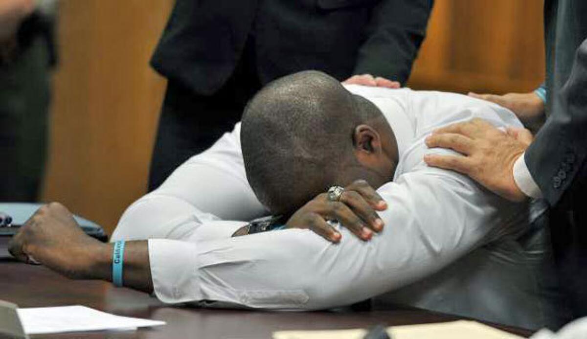 Brian Banks weeps after his rape conviction was dismissed.