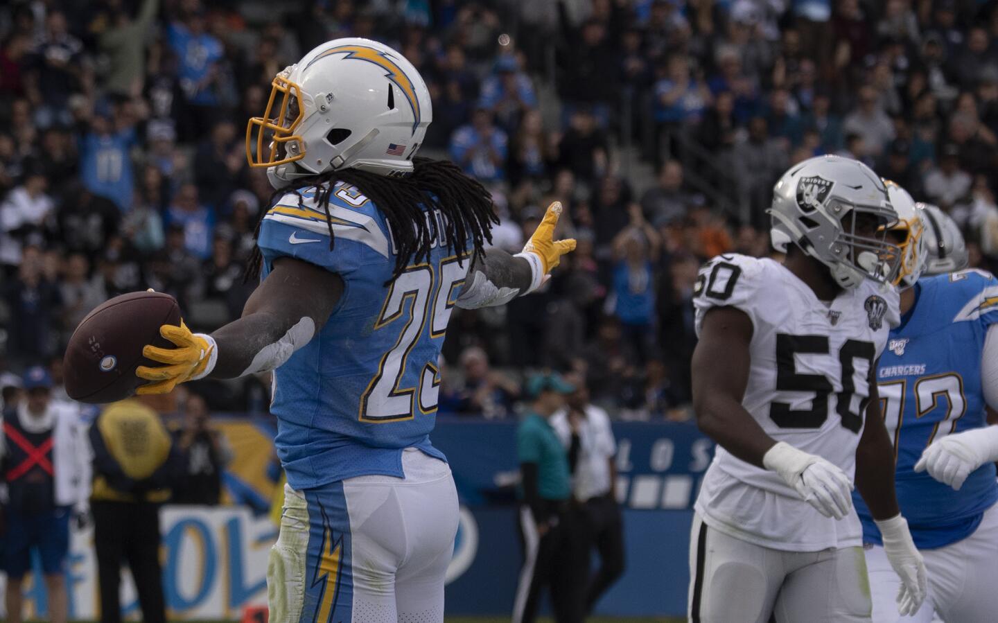 Chargers running back Melvin Gordon celebrates after scoring a touchdown against the Oakland Raiders.