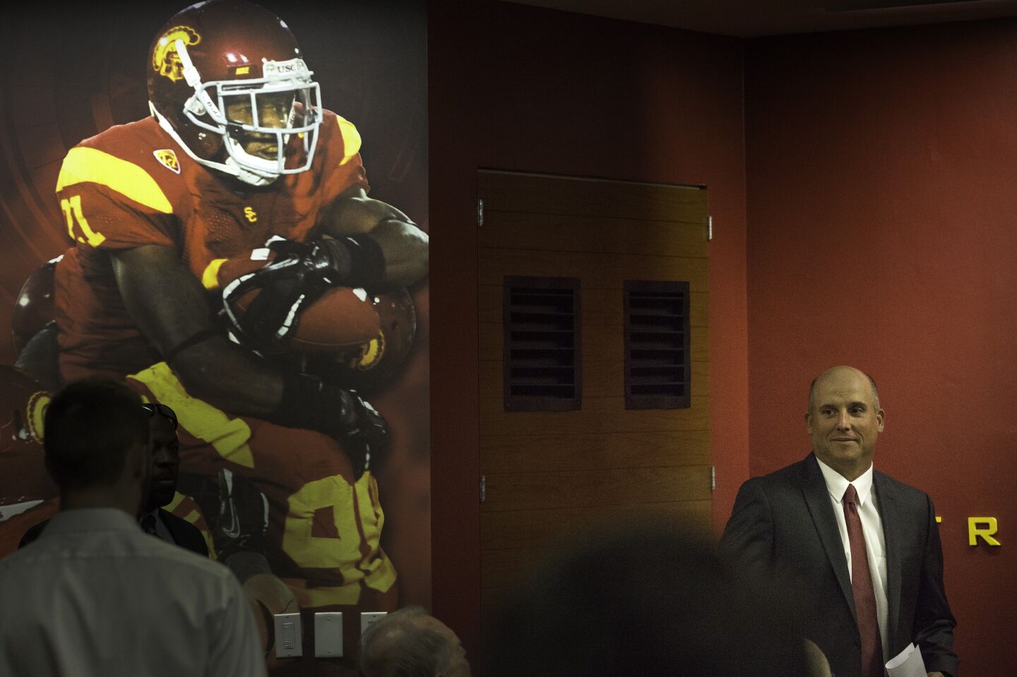 LOS ANGELES, CALIF. -- MONDAY, NOVEMBER 30, 2015: Clay Helton, right, waits to be introduced as the permanent head coach of USC football program during a press conference at the USC campus in Los Angeles, Calif., on Nov. 30, 2015.