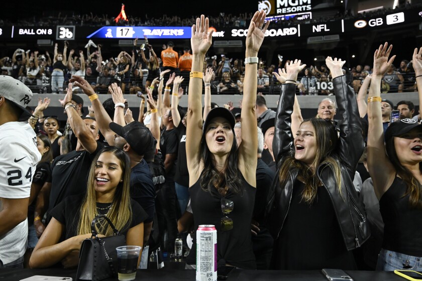 Fans cheer during the second half between the Las Vegas Raiders and the Baltimore Ravens.