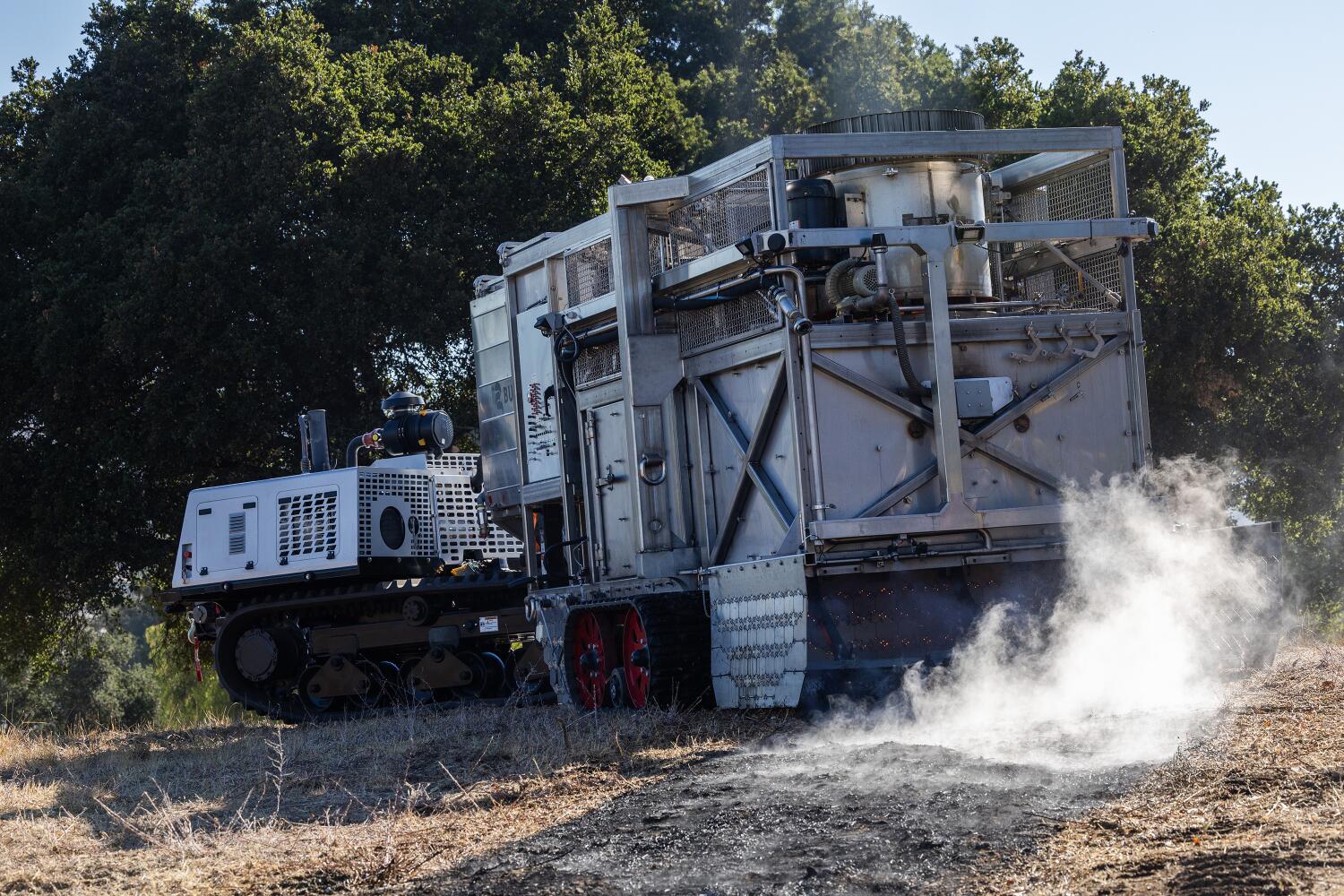 THOUSAND OAKS, CA - AUGUST 27: The BurnBot RX is a remote-controlled, prescribed-burn system that creates precise burns. The system is used to create fire breaks, fuel breaks and defensible space. The machine rolls 10-15 centimeters (4 to 6 inches) per second. The company's goal is to prescribe burn 1 million acres per year in the United States. (Myung J. Chun / Los Angeles Times)