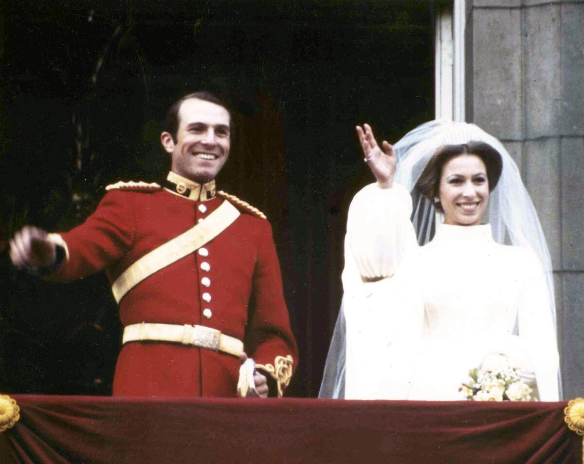 Nov. 14, 1973: Britain's Princess Anne, daughter of Queen Elizabeth II, and her husband Capt. Mark Phillips, wave from the balcony of Buckingham Palace following their wedding in Westminster Abbey.