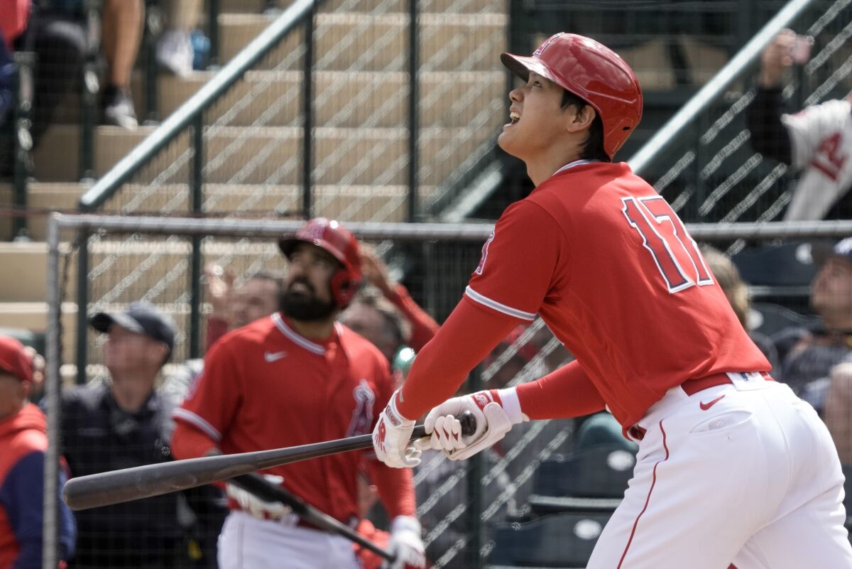 Angels star Shohei Ohtani hits a triple during a spring training game against the Chicago White Sox on Sunday.