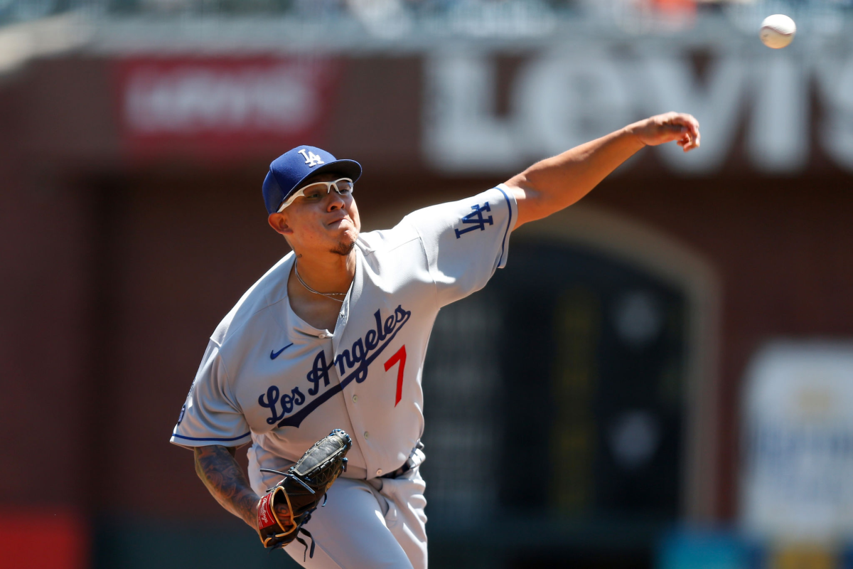Dodgers starting pitcher Julio Urías delivers during an 11-5 win over the San Francisco Giants at Oracle Park on Sunday.