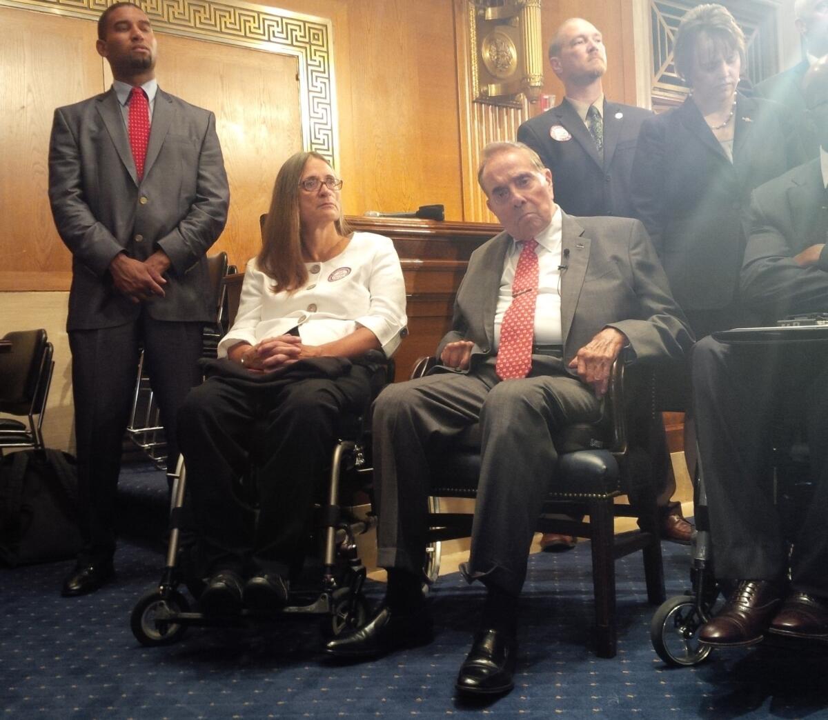 Former Sen. Bob Dole appears at a news conference on Capitol Hill, where he visited to support ratification of the Convention on the Rights of Persons with Disabilities.