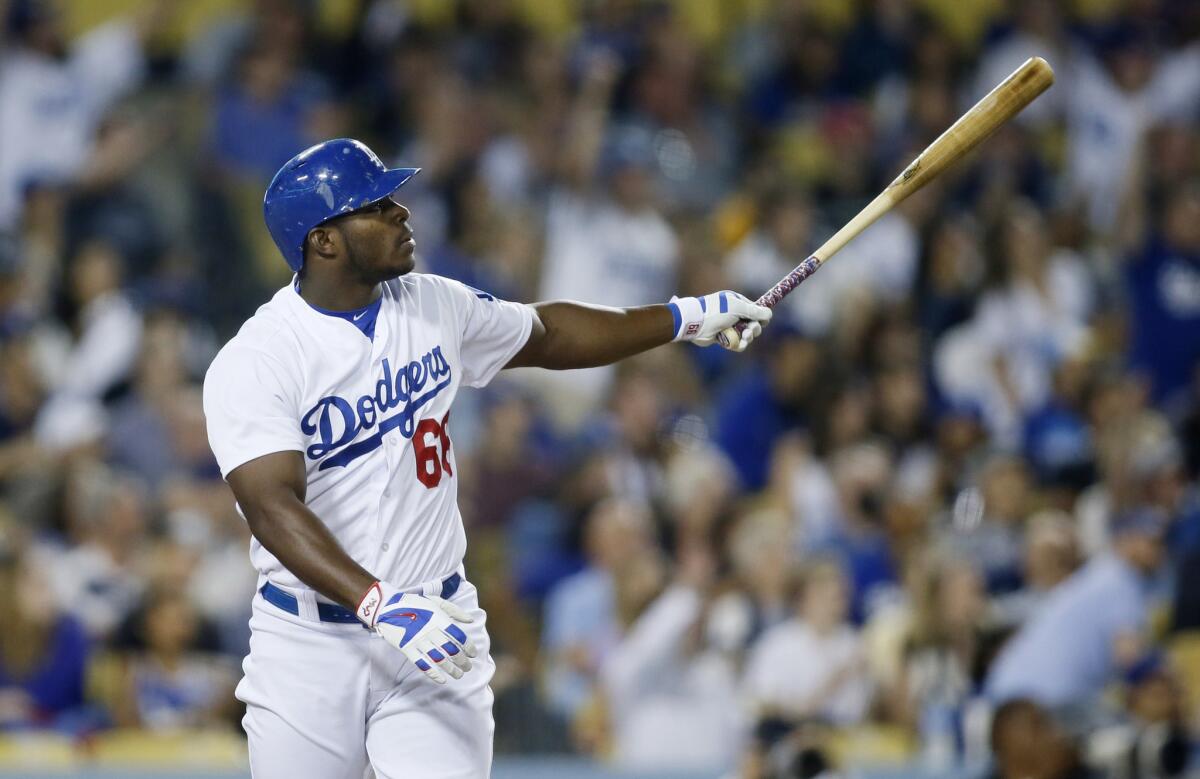 Dodgers right fielder Yasiel Puig watches his two-run home run against the Nationals in the fourth inning Tuesday night. He tied a career high with 5 RBIs.