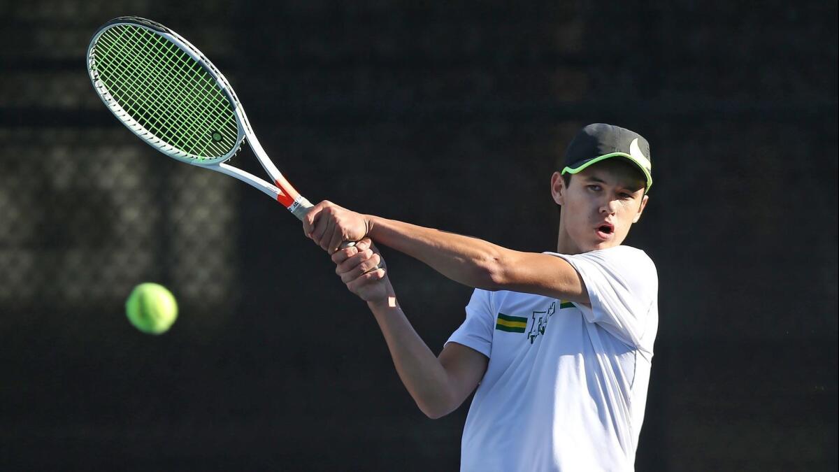 Edison High's Jason You, pictured hitting a backhand against Laguna Beach on March 7, helped the Chargers to a 10-8 win over Tesoro in Wednesday's CIF Southern Section Division 2 first-round match.