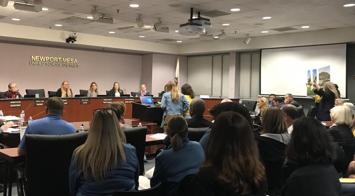 A Newport-Mesa Unified School District board of education meeting takes place in February 2020. 