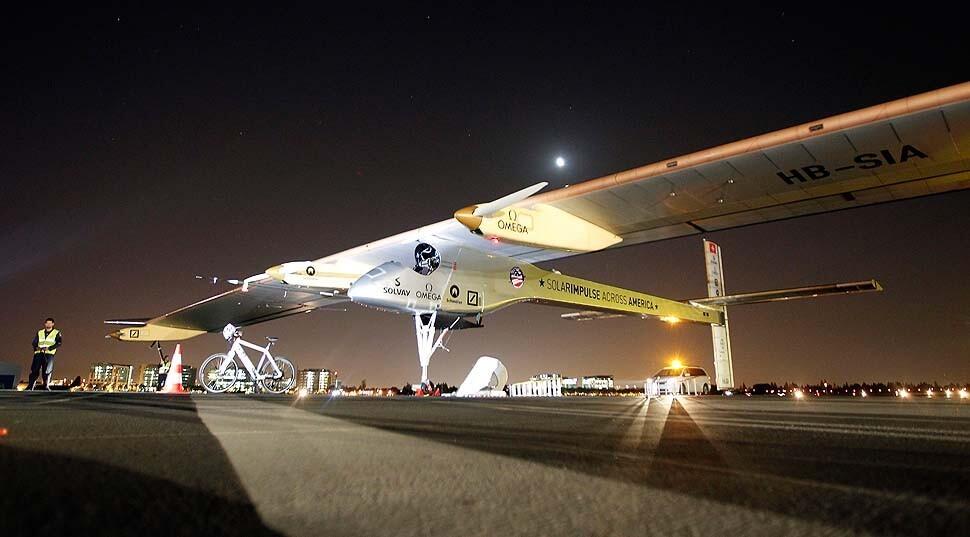 The Solar Impulse sits on the tarmac before takeoff from Moffett Field at NASA Ames Research Center in Mountain View, Calif.