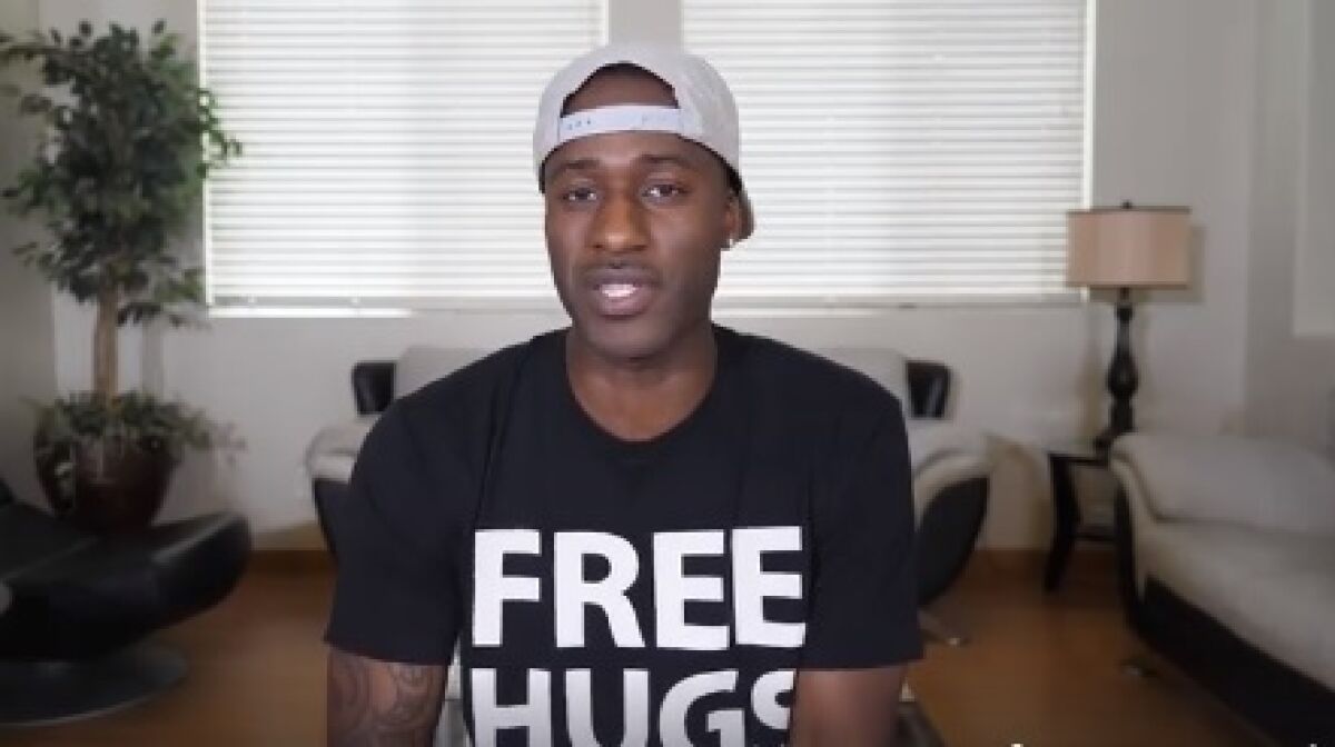 Ken E. Nwadike, 38, founder of the Free Hugs Project, was supposed to be giving a motivational speech and workshop at Harvard University on March 26, 2020. Instead, he was in his East Lake home telling people how social distancing can actually bring them closer.