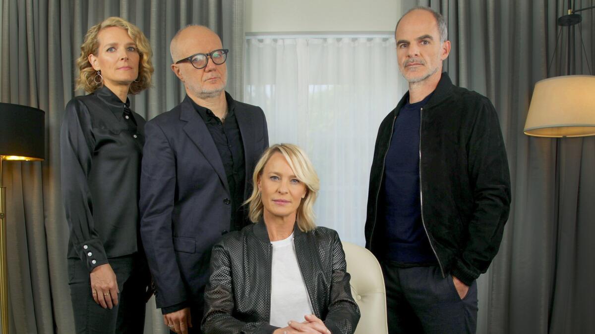 "House of Cards" showrunners Melissa James Gibson and Frank Pugliese, left, with actors Robin Wright and Michael Kelly.