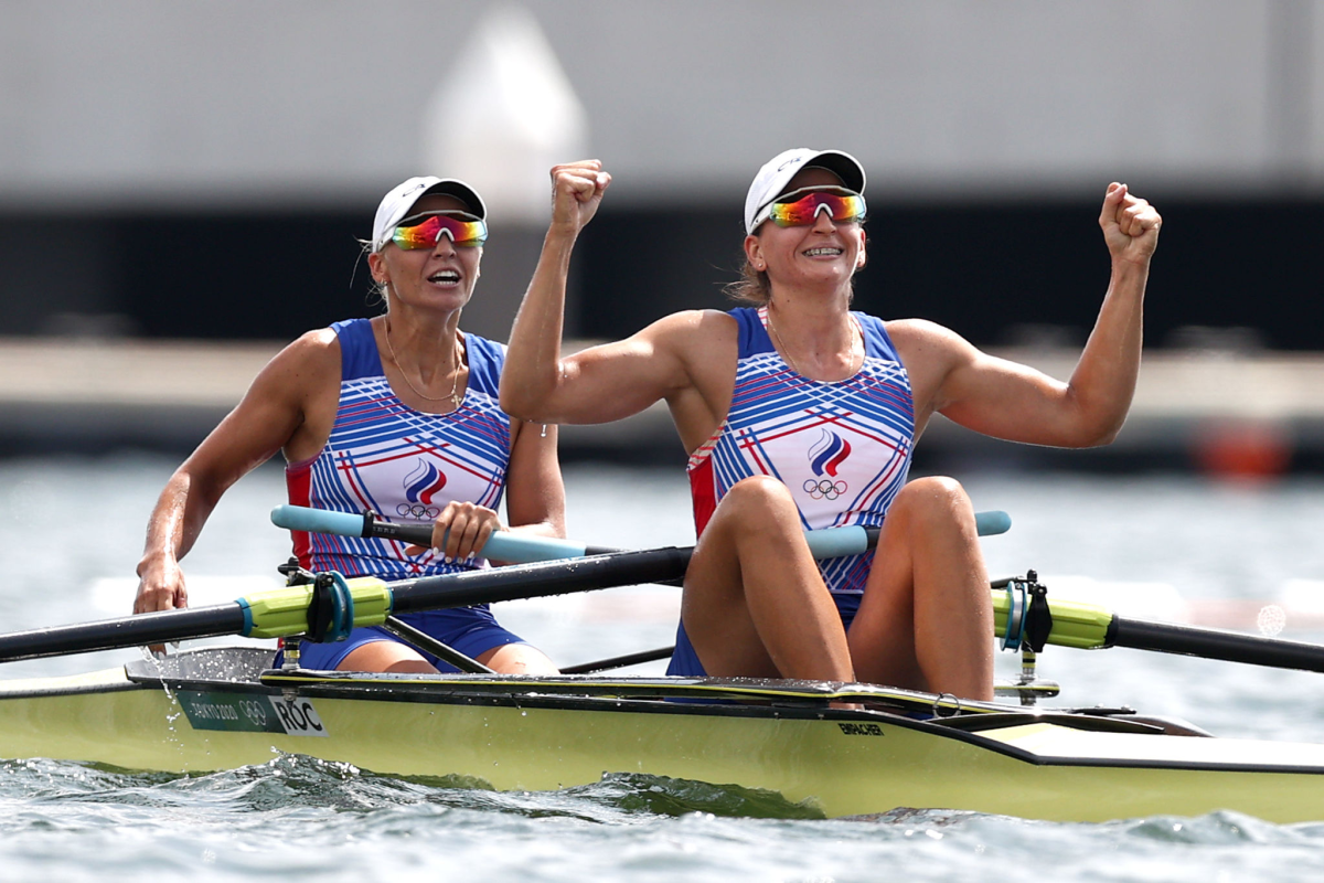 Vasilisa Stepanova and Elena Oriabinskaia of ROC celebrate after winning the silver medal in the women's pair rowing.