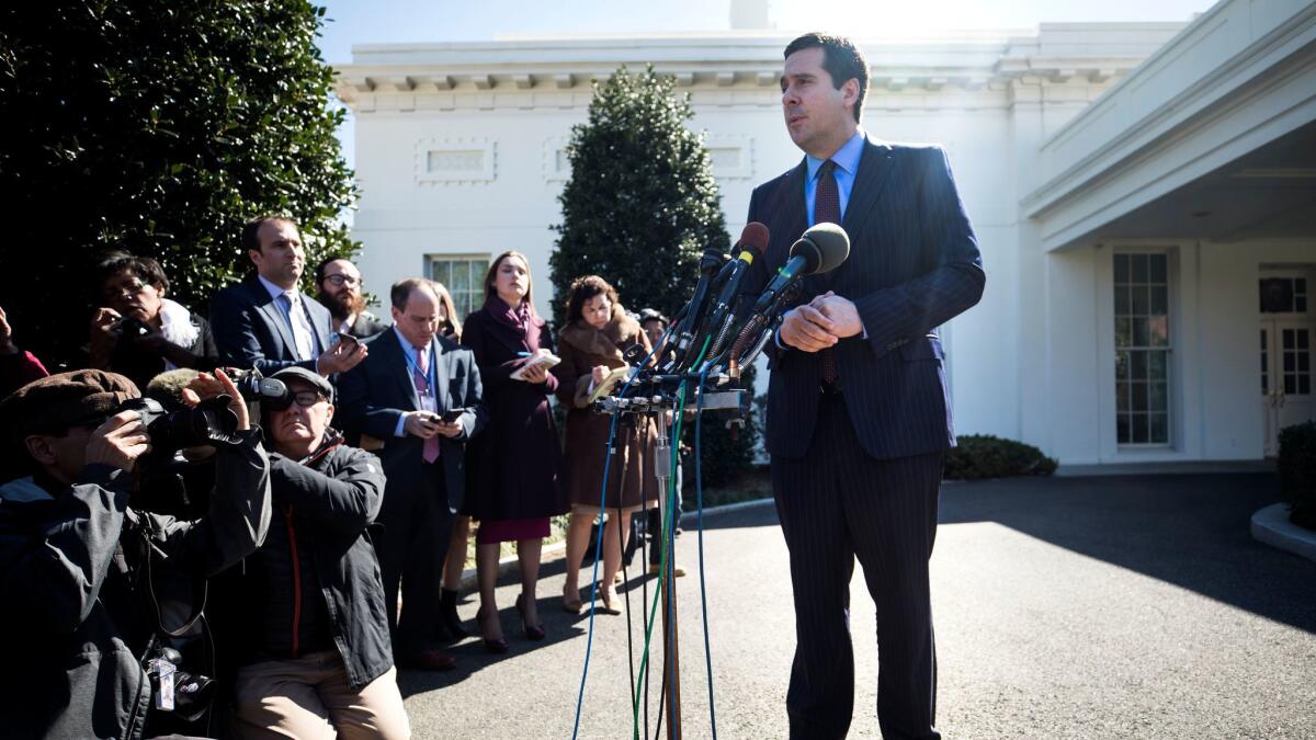 Chairman of the House Permanent Select Committee on Intelligence Devin Nunes speaks to the media outside the White House after meeting with President Trump on March 22. (Jim Lo Scalzo / EPA)