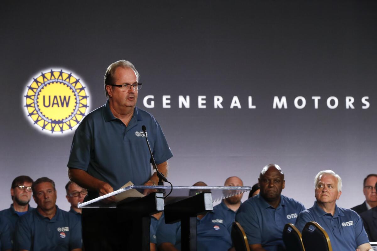 United Auto Workers President Gary Jones, shown speaking during the opening of contract talks with General Motors, stepped aside Saturday amid a Justice Department probe.
