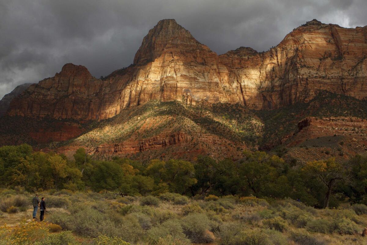 The late afternoon sun in October lights up the entrance to Zion National Park in Utah. Thousands of hikers, bikers and nature-lovers traveled to Utah's red rock national parks after the state paid to reopen them during the government shutdown.