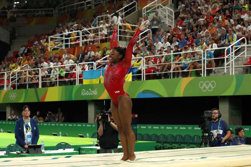 U.S. gymnast Simone Biles sticks her landing during the women's vault competition at Rio Olympic Arena. Biles scored a 15.966 for a gold medal.