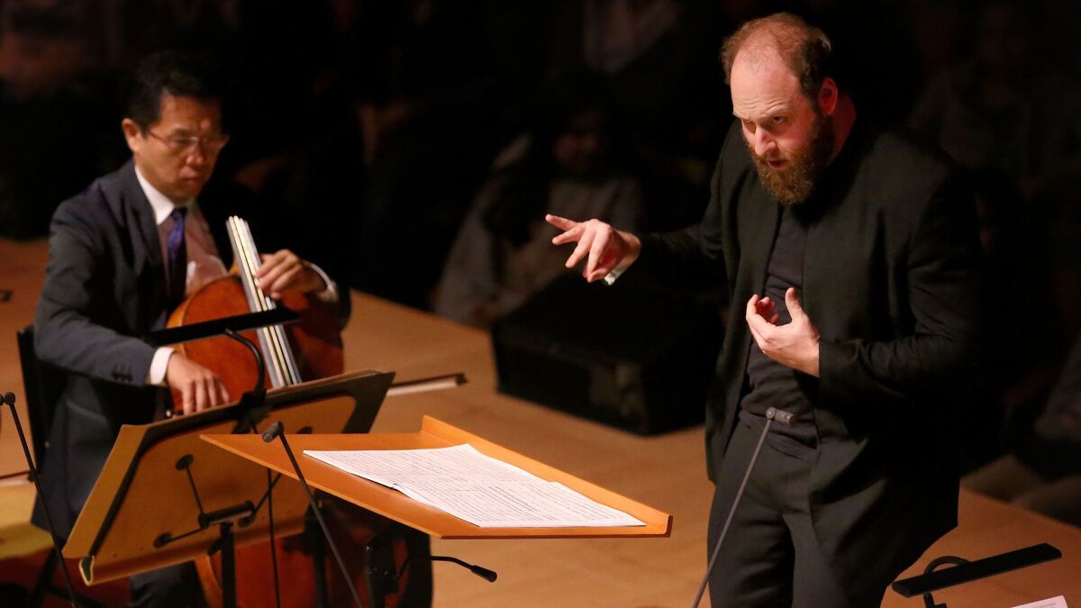 Christopher Rountree conducts the Los Angeles Philharmonic during a concert celebrating the work of high school composers' work at Walt Disney Concert Hall.