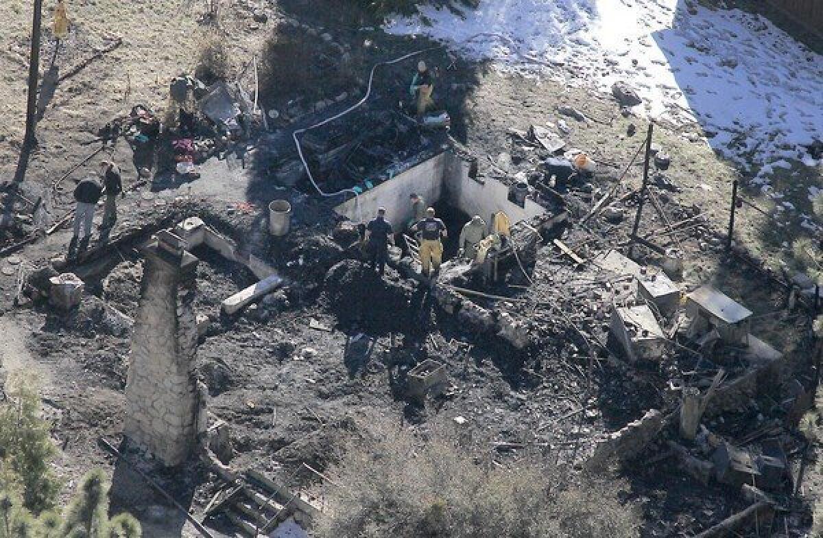Investigators on Wednesday were trying to identify the human remains found in the charred cabin where fugitive ex-LAPD officer Christopher Dorner was believed to have died after a standoff with police.
