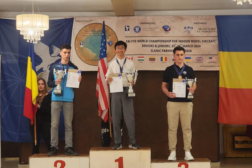 Daniel Guo (center) took first place in the F1D model airplane world championships last month.