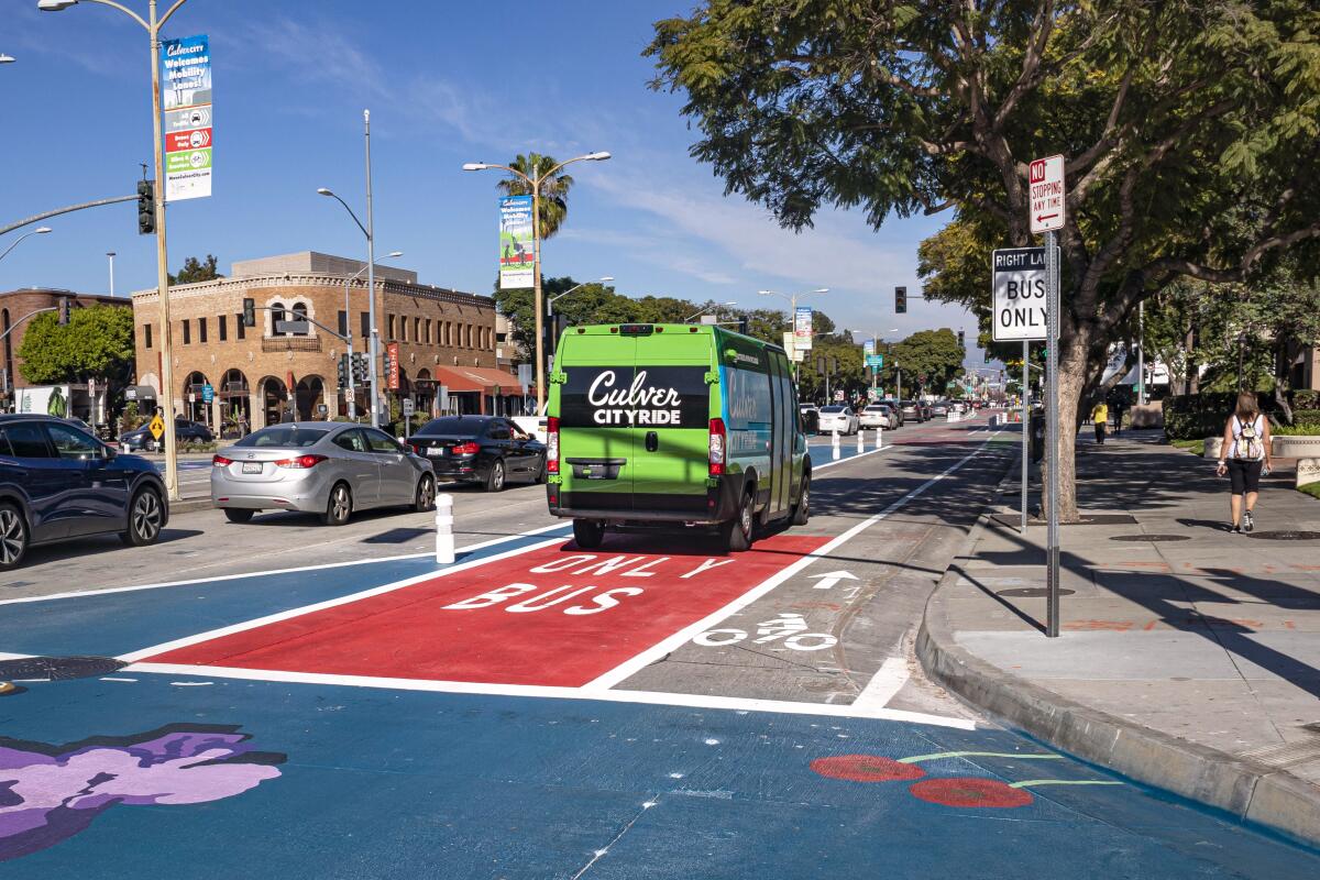 A city bus drives in a bus-only lane next to a bike lane in Culver City.