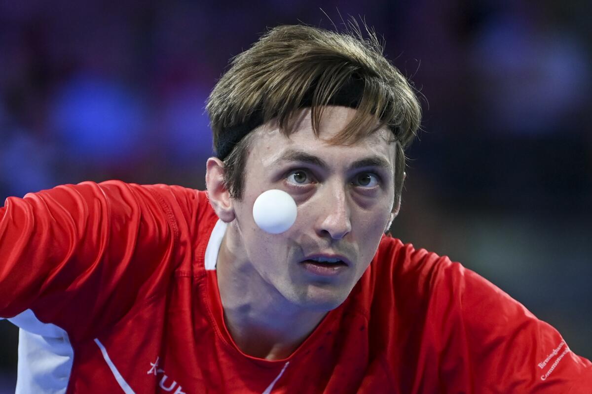 Liam Pitchford of England serves to Sharath Kamal Achanta of India in the men's singles table tennis gold medal match at the Commonwealth Games in Birmingham, England, Monday, Aug. 8, 2022. (AP Photo/Rui Vieira)
