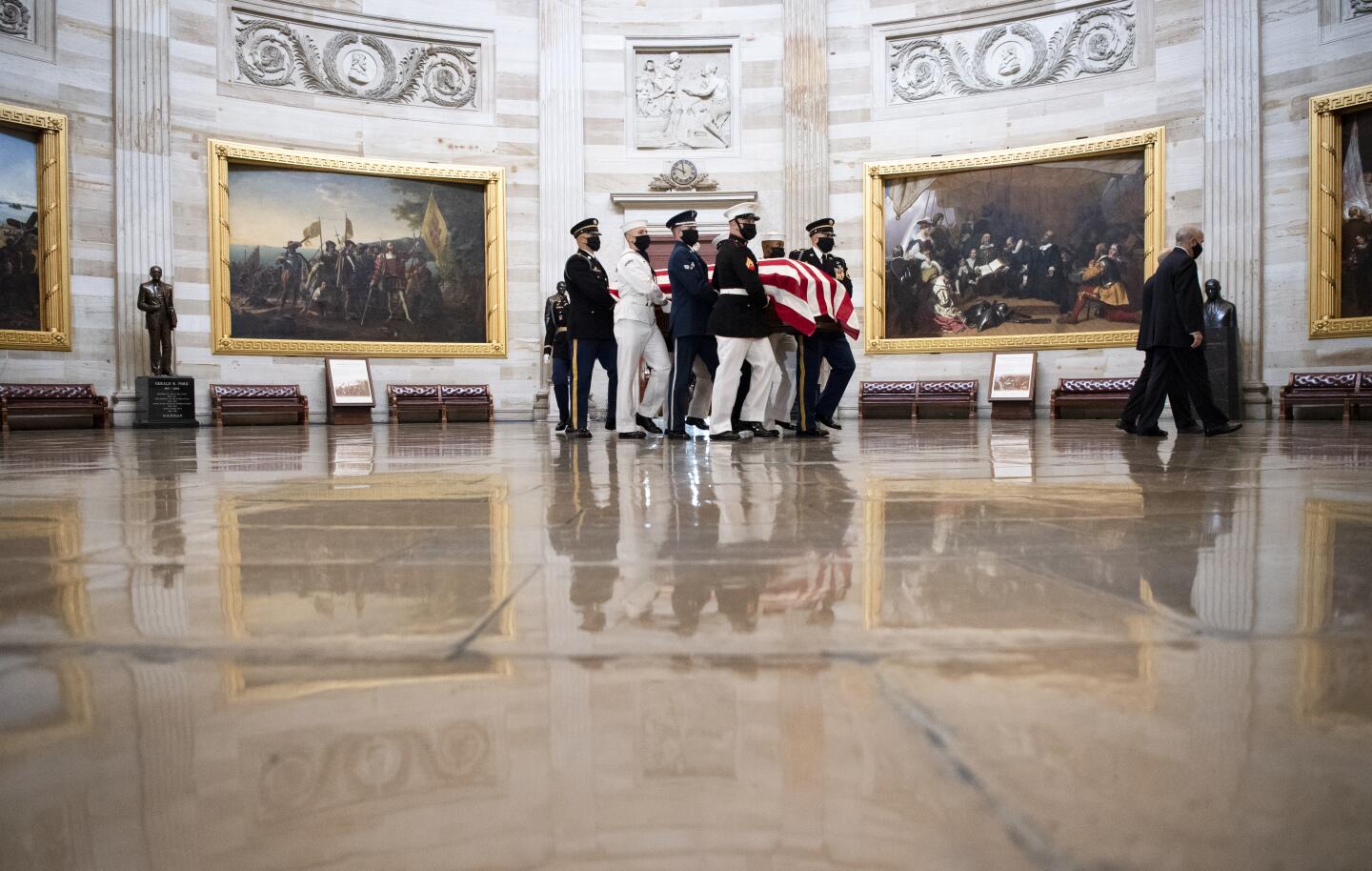 The casket of Justice Ruth Bader Ginsburg is carried by a military honor guard to lie in state at the U.S. Capitol