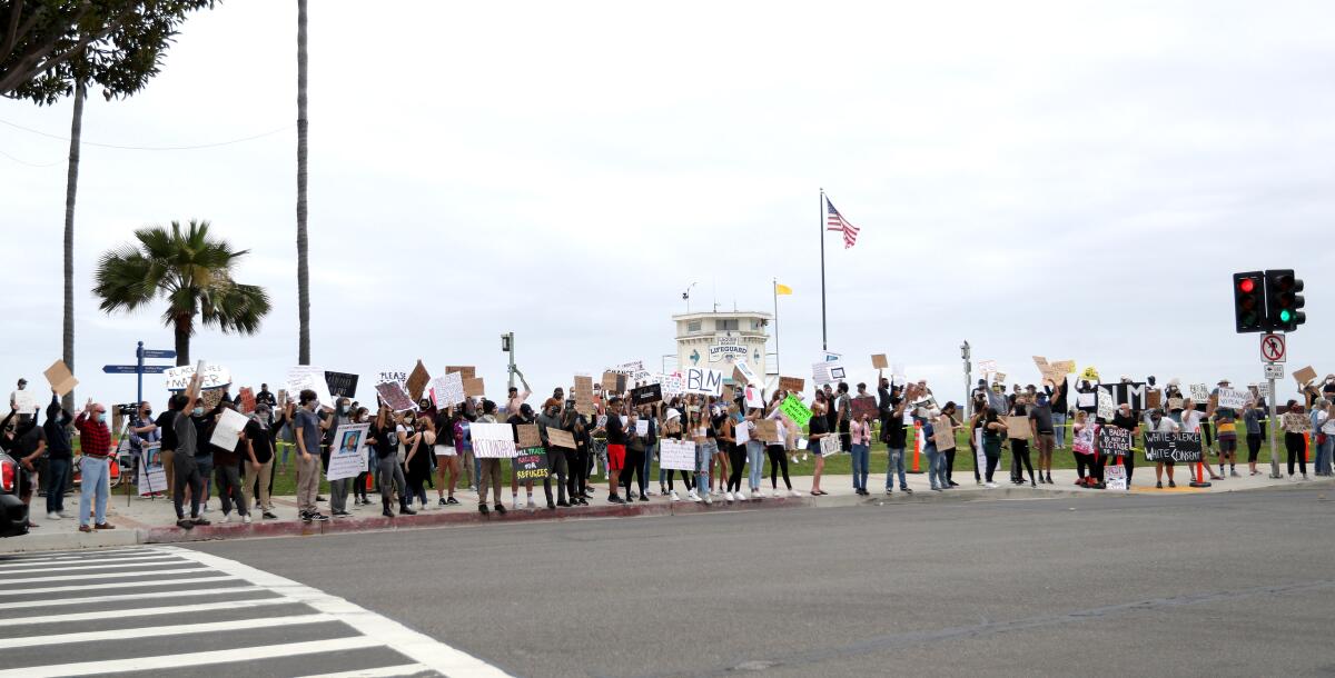 Dozens of Black Lives Matter protesters held signs and chanted at Main Beach Park in Laguna Beach on Friday, June 5, 2020.