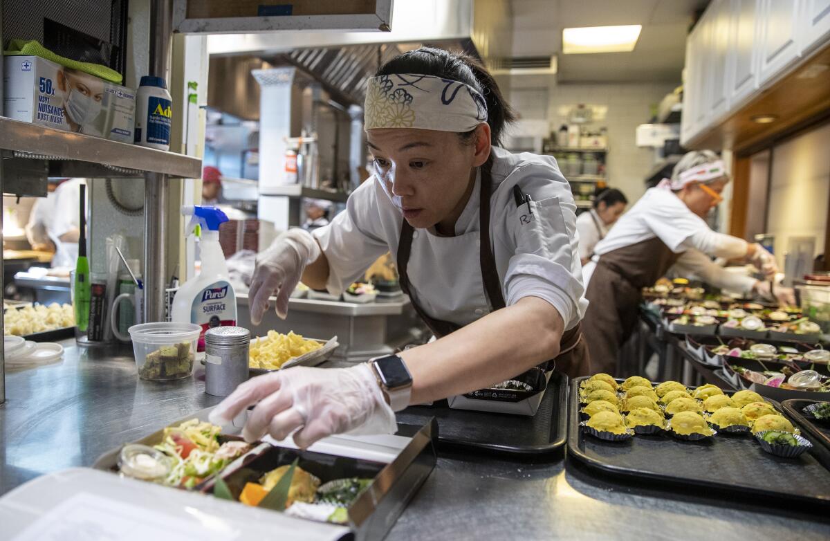 Carole Iida-Nakayama prepares $38 bento boxes at n/naka on Tuesday. Dinner at the Palms kaiseki restaurant, one of the hardest-to-score reservations in town, normally costs $275.