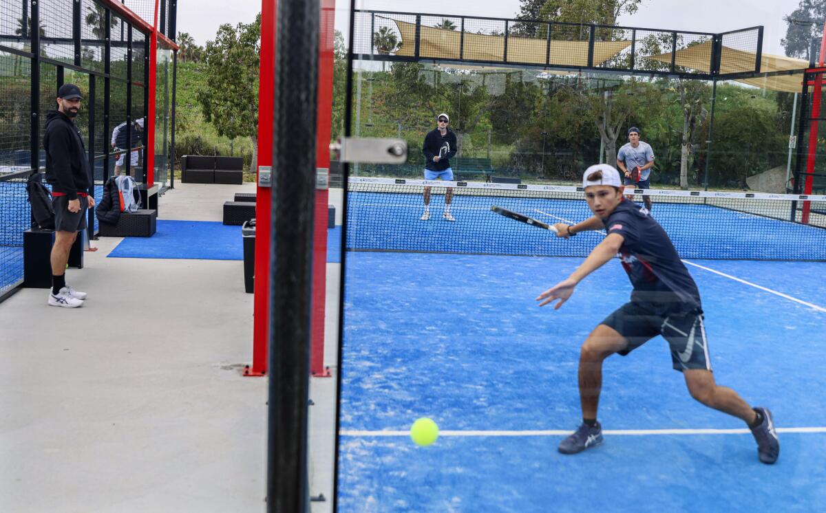 Members play padel at the Barnes Tennis Center in San Diego, April 11, 2023. 