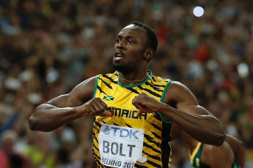 Jamaica's Usain Bolt celebrates after winning the men's 200-meter final at the world championships in Beijing in August.