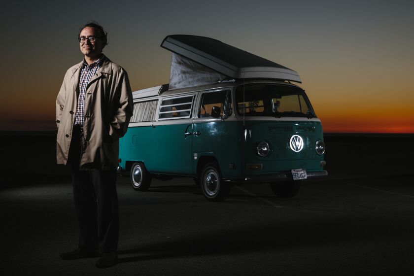 EL SEGUNDO, CALIF. - MARCH 13: LA Times writer Gustavo Arellano poses for a portrait with his Volkswagen Bus at Dockweiler Beach Park on Wednesday, March 13, 2019 in El Segundo, Calif. (Kent Nishimura / Los Angeles Times)