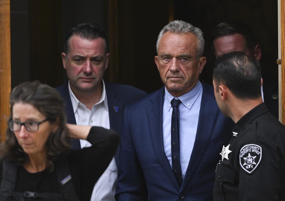 Robert F. Kennedy Jr. leaves a courthouse.