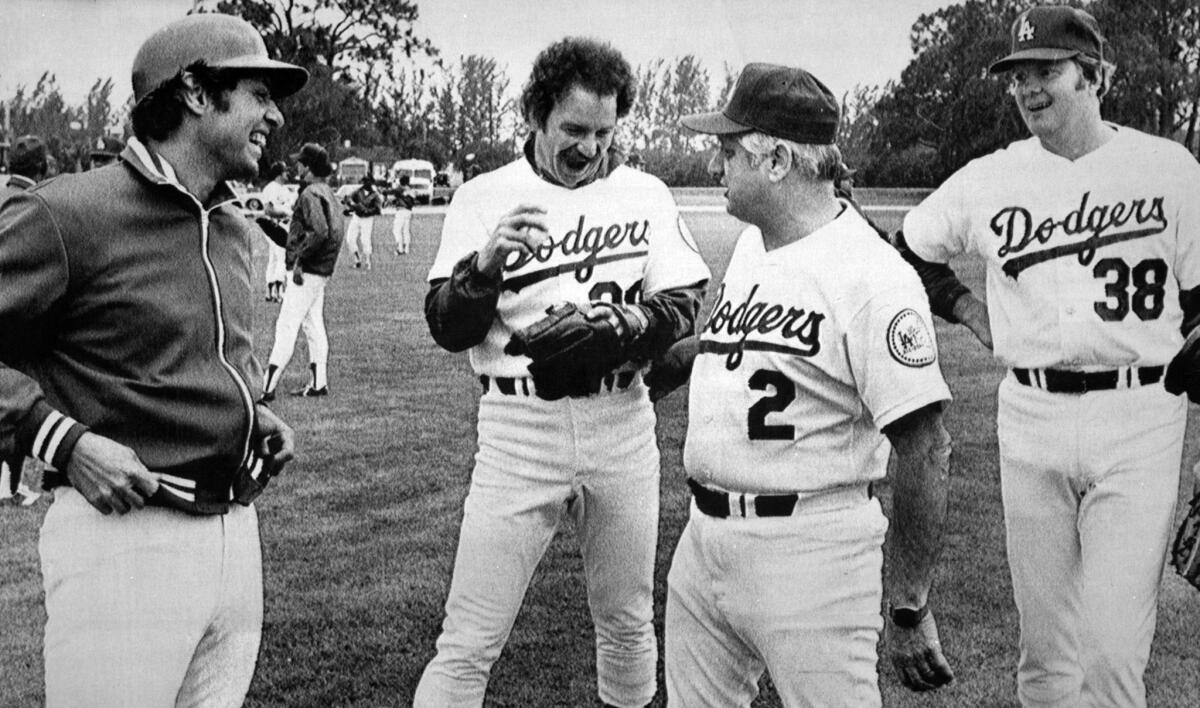 March 2, 1980: Manager Tommy Lasorda, second from right, chats with Jay Johnstone, left, Don Stanhouse and Dave Goltz after the three free agents were acquired by the Dodgers.