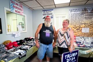 Chuck and Jodi Pflugh buy a Trump 2024 lawn sign at the headquarters of the United Republicans of Butler County.