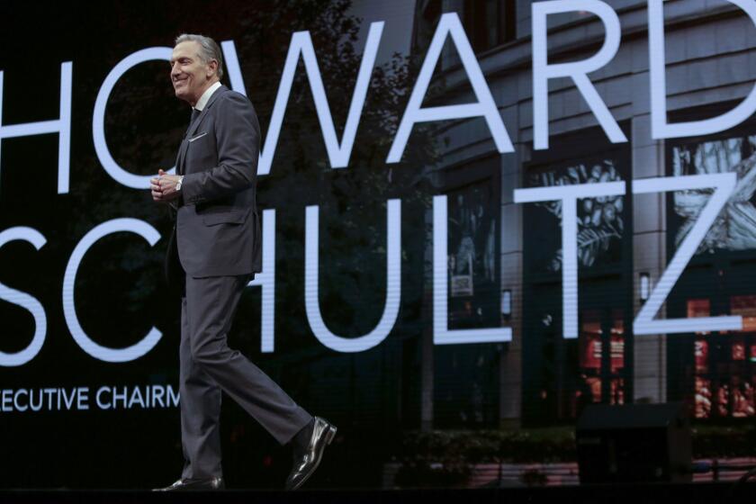 Starbucks Executive Chairman Howard Schultz walks on stage at the Starbucks Annual Meeting of Shareholders at McCaw Hall in Seattle, Washington on March 21, 2018. / AFP PHOTO / Jason Redmond (Photo credit should read JASON REDMOND/AFP/Getty Images)