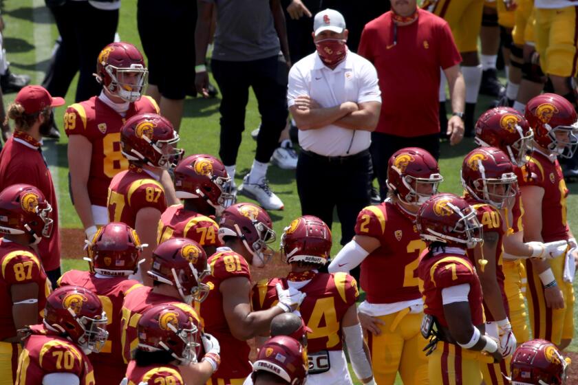 USC coach Clay Helton looks on at the Trojans' spring game at the Coliseum on April 17, 2021.