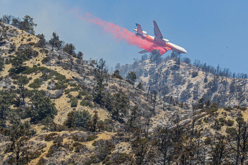 Wrightwood, CA, Monday, June 13, 2022 - A 10 Tanker DC-10 jet delivers fire retardant as crews continue to battle the Sheep Fire. (Robert Gauthier/Los Angeles Times)