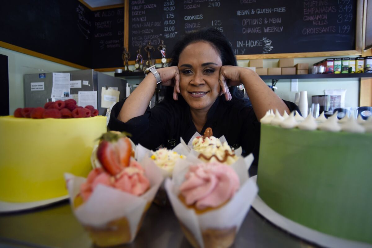 Shirley Hughes, owner of Sweet Cheats bakery, poses for a photo, Friday, April 15, 2022, in Atlanta. Some small businesses are still struggling to hire qualified workers, even as the broader picture in the U.S. job market looks much brighter. (AP Photo/Mike Stewart)
