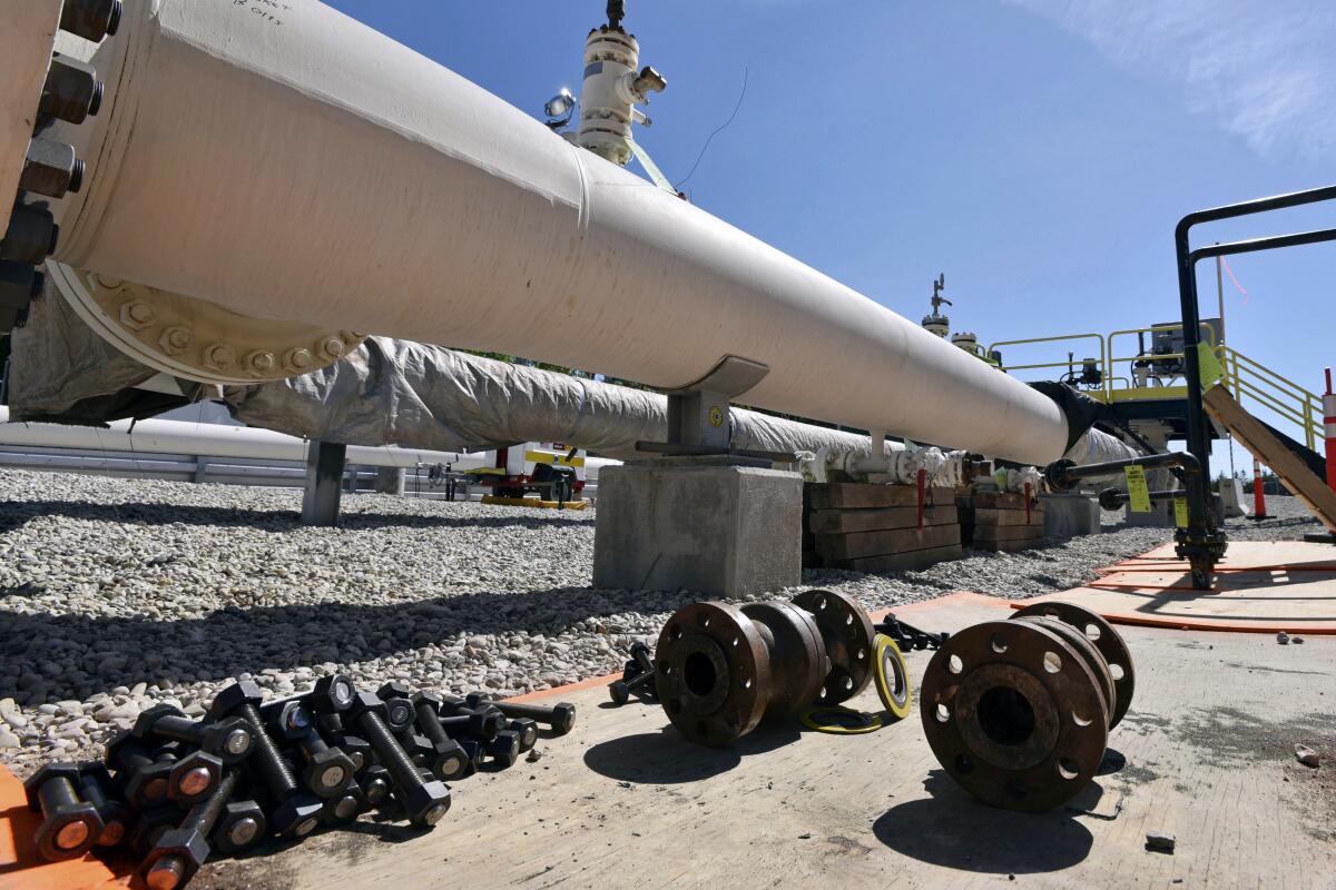 FILE - In this June 8, 2017, file photo, fresh nuts, bolts and fittings are ready to be added to the east leg of the pipeline near St. Ignace, Mich., as Enbridge Inc., prepares to test the east and west sides of the Line 5 pipeline under the Straits of Mackinac in Mackinaw City, Mich. A Michigan regulatory panel said Thursday, July 7, 2022, that it needs more information about safety risks before it can rule on Enbridge's plan to extend an oil pipeline through a tunnel beneath a waterway linking two of the Great Lakes. (Dale G Young/Detroit News via AP, File)