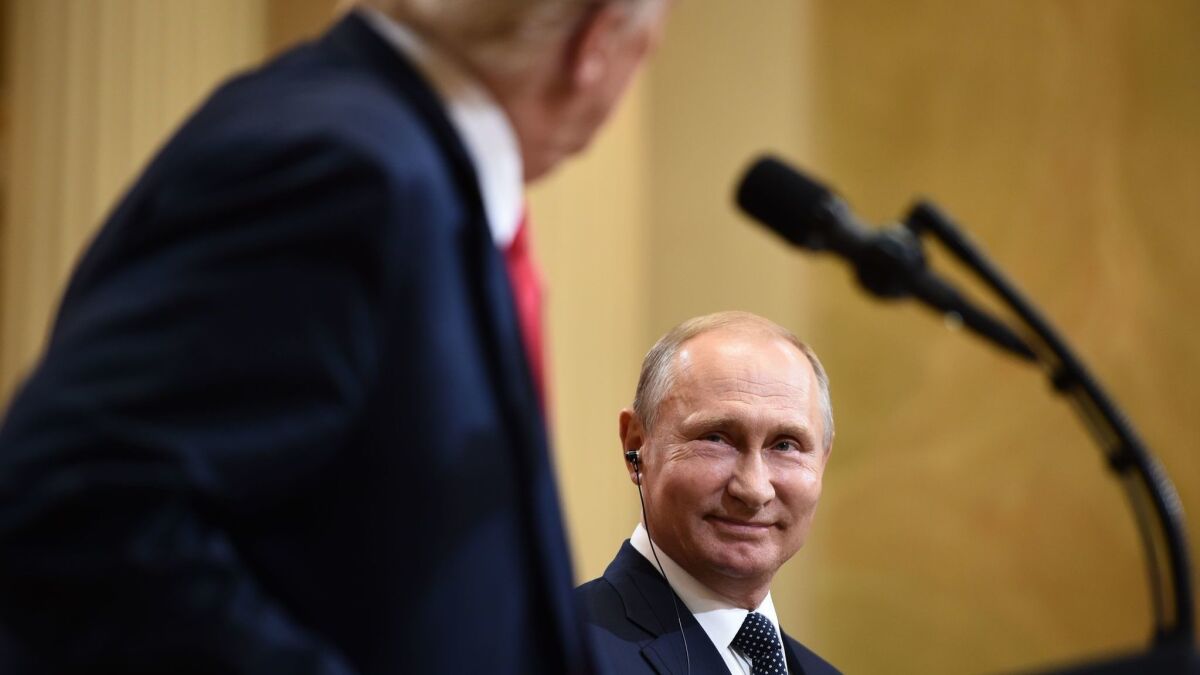 President Trump and Russia's President Vladimir Putin attend a news conference after a meeting at the Presidential Palace in Helsinki on July 16, 2018.