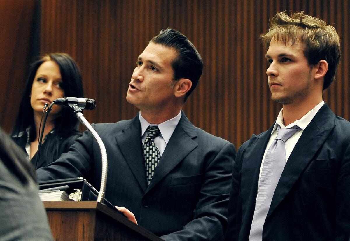 Nicholas Frank Prugo, right, listens as his attorney Sean Erenstoft addresses the court in 2009.