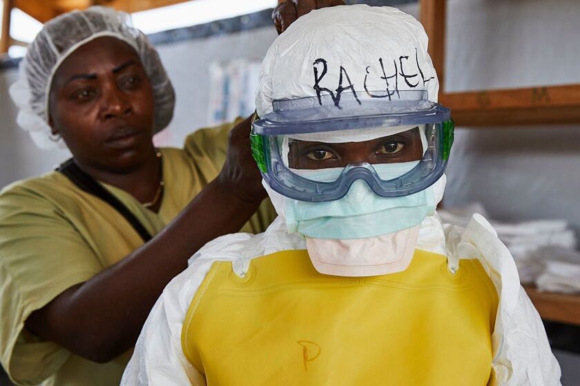 Mandatory Credit: Photo by HUGH KINSELLA CUNNINGHAM/EPA-EFE/REX (10228147a) A health worker gets dressed in protective medical garments at an Ebola transit centre in Beni in North Kivu province, Democratic Republic of the Congo, 04 May 2019. The death toll from the latest Ebola outbreak which began in Agusut 2018 has risen to more than 1,000, according to the country's Ministry of Public Health. The ministry said in its latest update on 03 May that there has been 1,008 deaths from 1,463 confirmed cases since August 2018. Volatile security situations in the region is hampering the effort to contain the disease in the vast central African nation. Congo Ebola death toll hits 1,000, Beni, Congo, The Democratic Republic Of The - 04 May 2019 ** Usable by LA, CT and MoD ONLY **