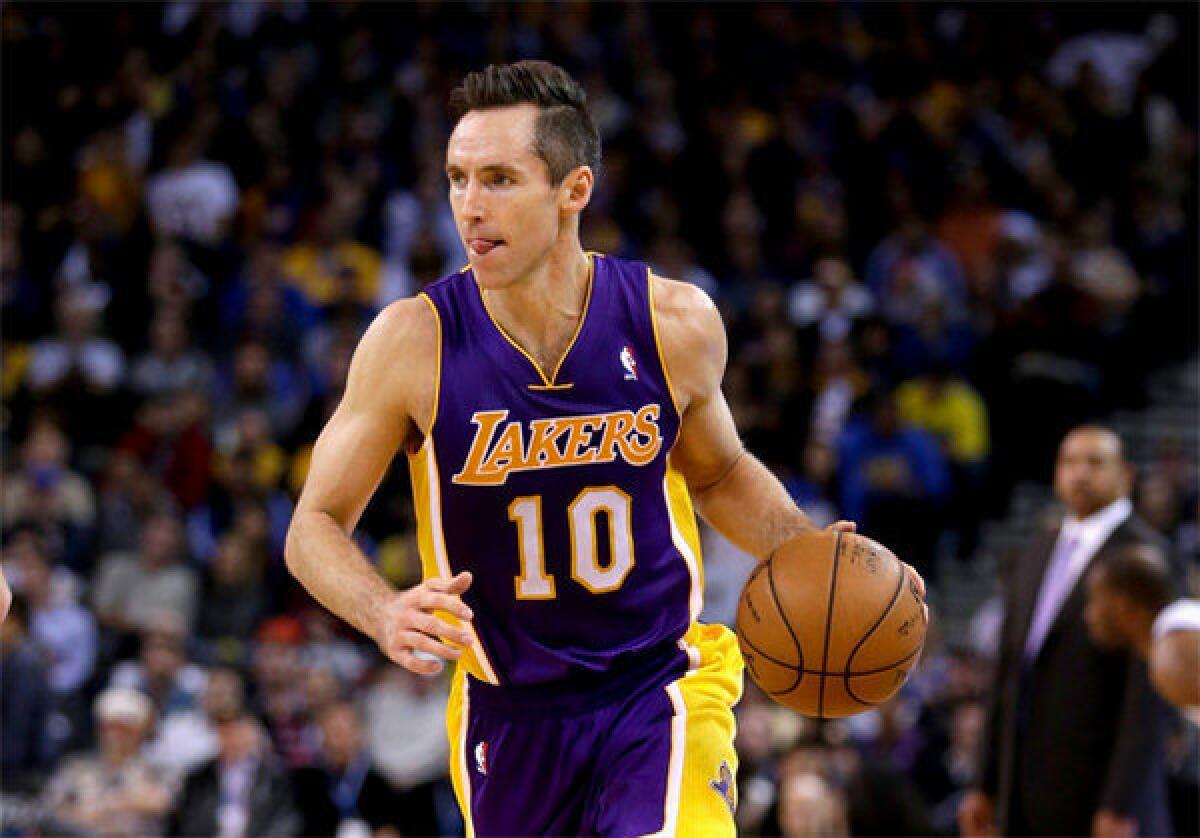 Steve Nash dribbles up the court in his first game back since injuring his leg on Oct. 31.