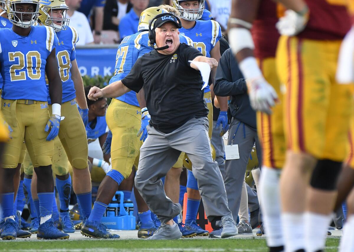 UCLA coach Chip Kelly cheers on his players during last year's victory over USC at the Rose Bowl.